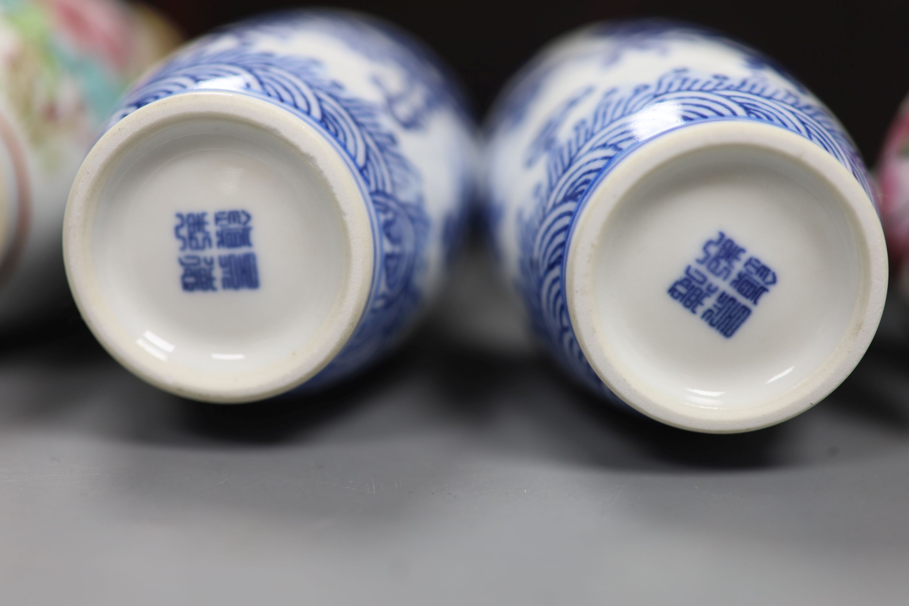 A boxed set of five small Chinese vases